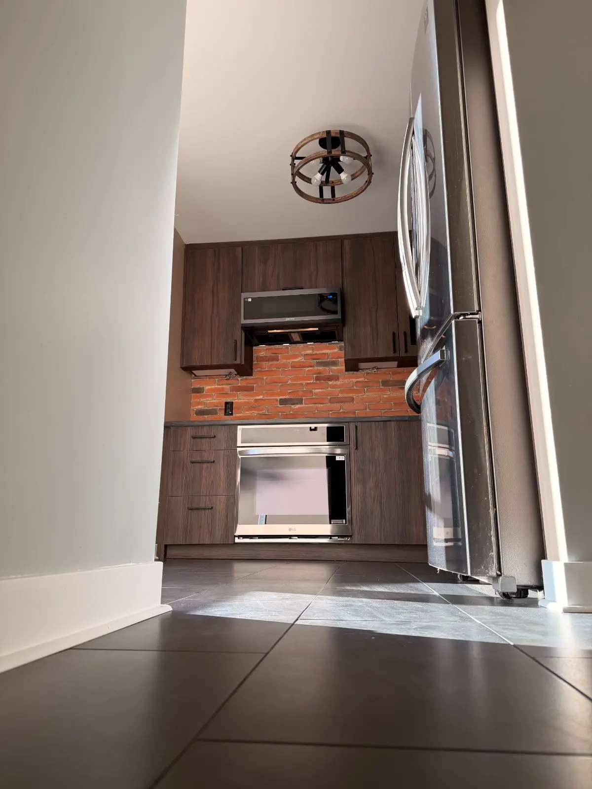 dark tile installed for kitchen floor
